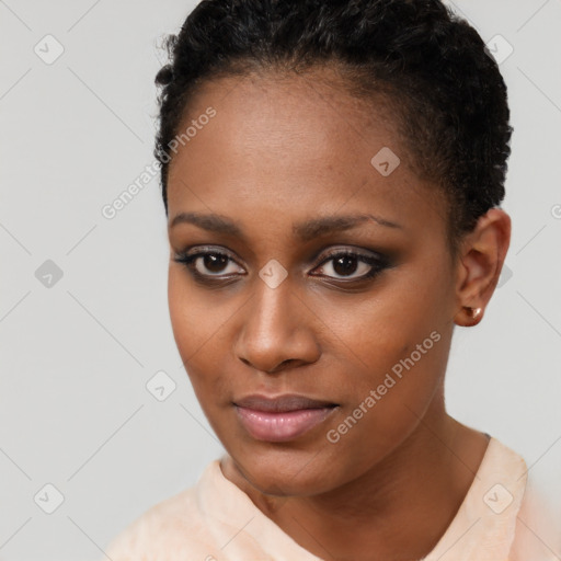 Joyful black young-adult female with short  brown hair and brown eyes