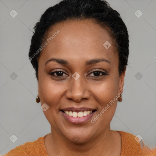 Joyful black young-adult female with short  brown hair and brown eyes