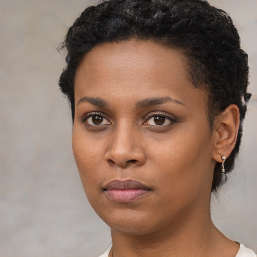 Neutral black young-adult female with short  brown hair and brown eyes