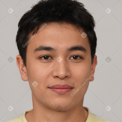 Joyful asian young-adult male with short  brown hair and brown eyes