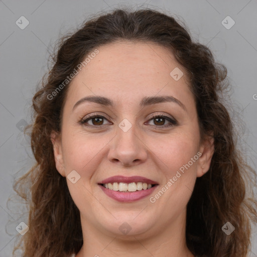 Joyful white adult female with long  brown hair and brown eyes