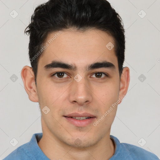 Joyful latino young-adult male with short  brown hair and brown eyes