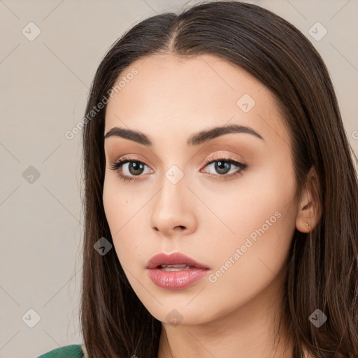 Neutral white young-adult female with long  brown hair and brown eyes