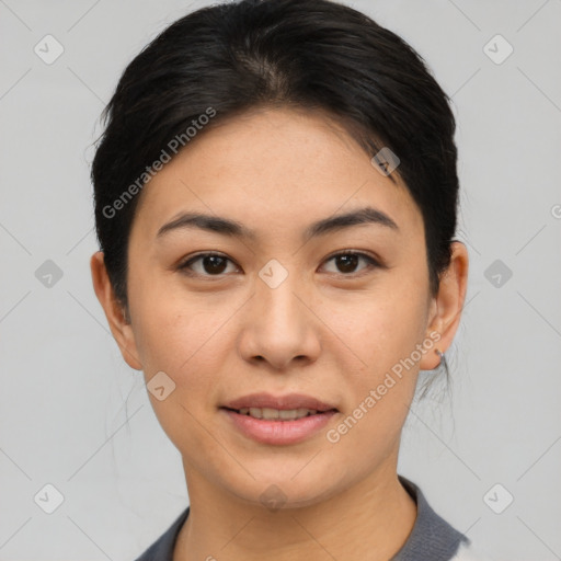 Joyful asian young-adult female with short  black hair and brown eyes