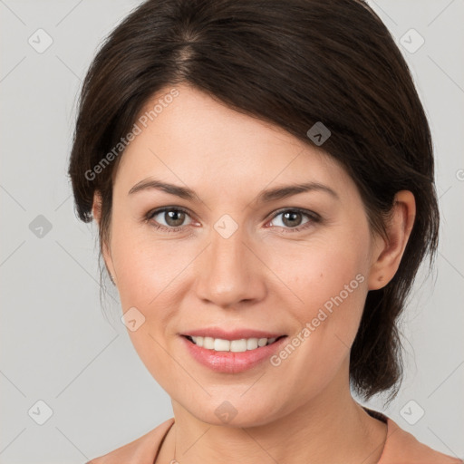 Joyful white young-adult female with medium  brown hair and grey eyes