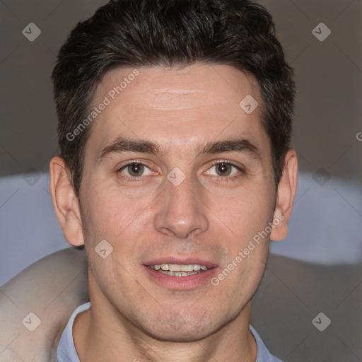 Joyful white adult male with short  brown hair and brown eyes