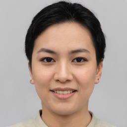 Joyful asian young-adult female with short  black hair and brown eyes