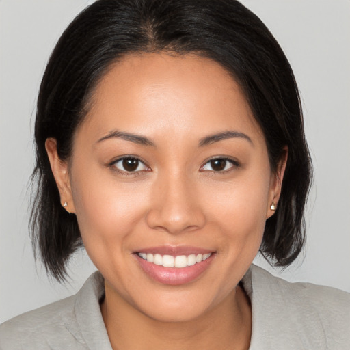 Joyful white young-adult female with medium  brown hair and brown eyes