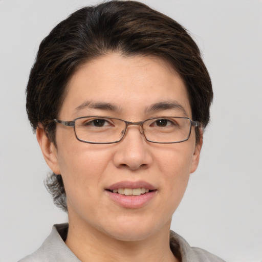 Joyful white adult female with short  brown hair and brown eyes