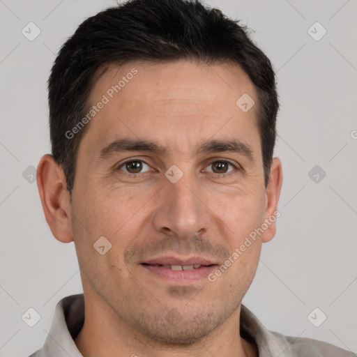 Joyful white adult male with short  brown hair and brown eyes