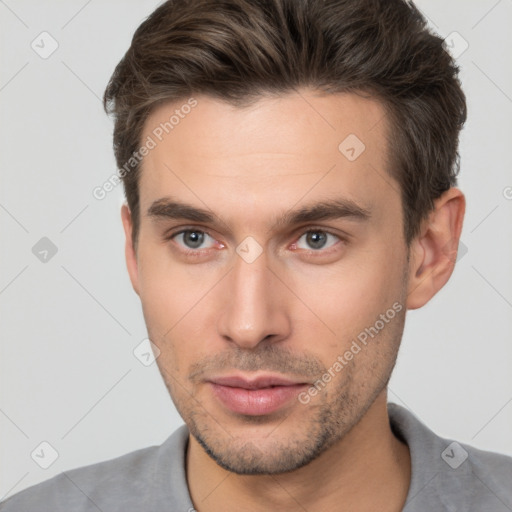 Neutral white young-adult male with short  brown hair and brown eyes