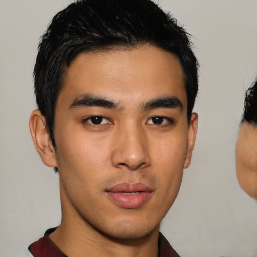 Neutral asian young-adult male with short  brown hair and brown eyes
