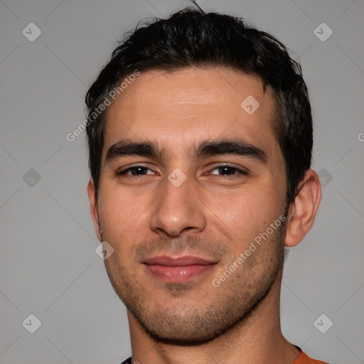 Joyful white young-adult male with short  black hair and brown eyes