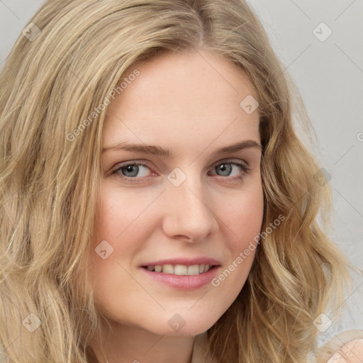 Joyful white young-adult female with long  brown hair and blue eyes