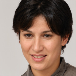 Joyful white adult female with medium  brown hair and brown eyes