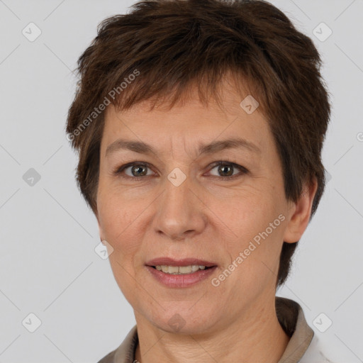 Joyful white adult female with short  brown hair and brown eyes