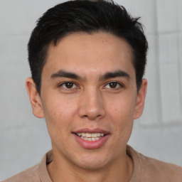 Joyful latino young-adult male with short  brown hair and brown eyes