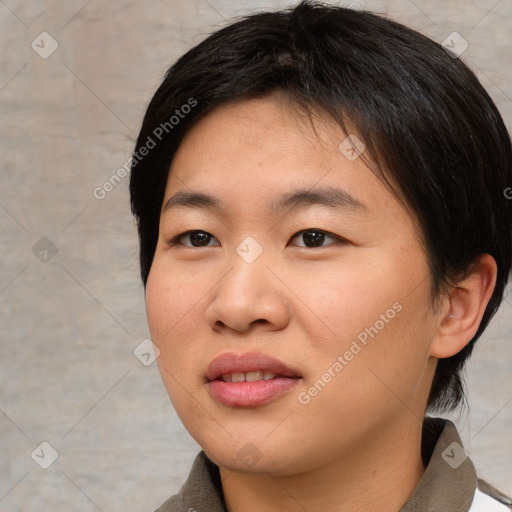 Joyful asian young-adult female with short  black hair and brown eyes