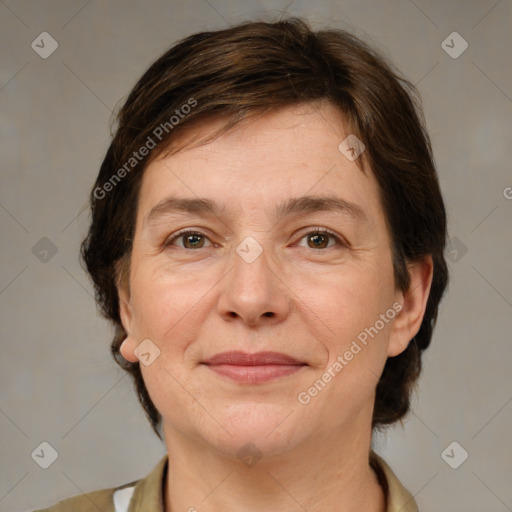 Joyful white adult female with medium  brown hair and brown eyes