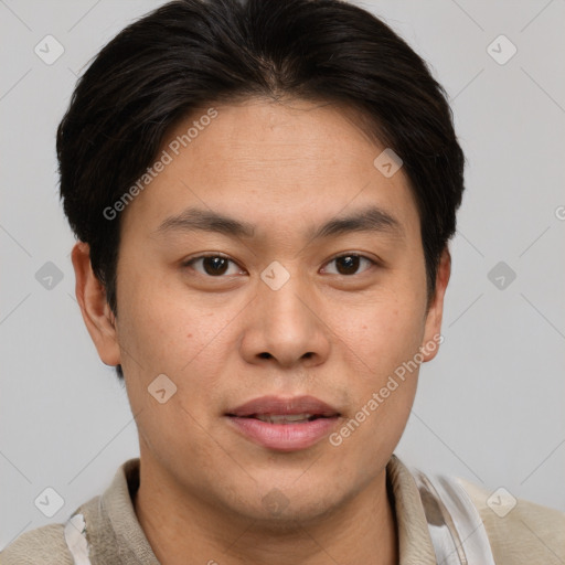 Joyful asian young-adult male with short  brown hair and brown eyes