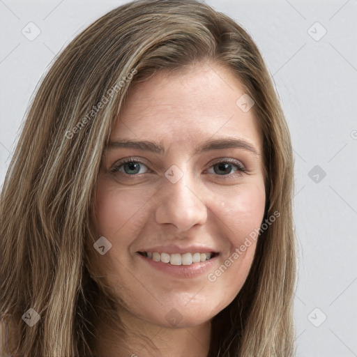 Joyful white young-adult female with long  brown hair and grey eyes