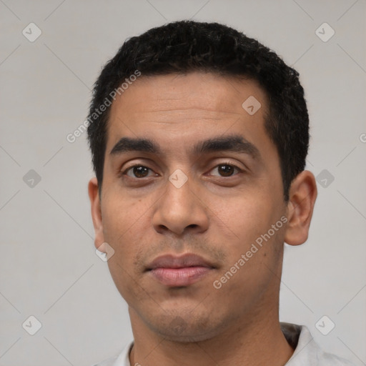 Neutral latino young-adult male with short  black hair and brown eyes