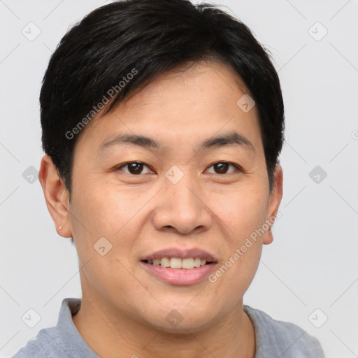 Joyful asian young-adult male with short  brown hair and brown eyes