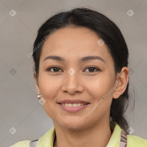 Joyful latino young-adult female with medium  brown hair and brown eyes