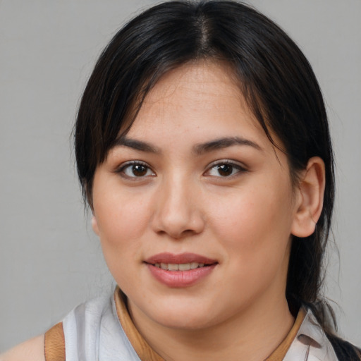 Joyful white young-adult female with medium  brown hair and brown eyes