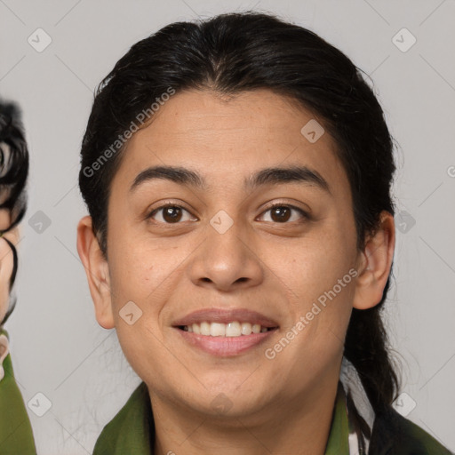 Joyful latino young-adult female with medium  brown hair and brown eyes