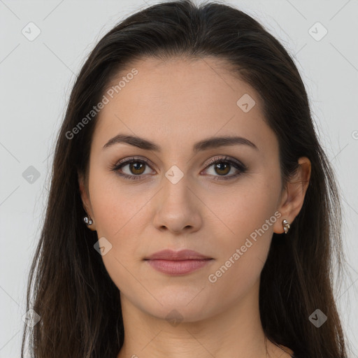 Joyful white young-adult female with long  brown hair and brown eyes