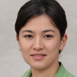 Joyful white young-adult female with medium  brown hair and brown eyes