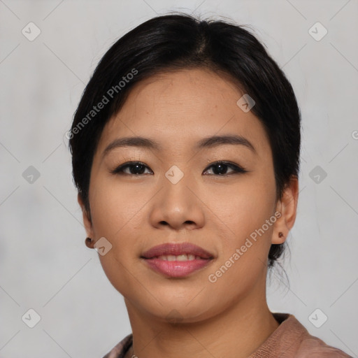 Joyful asian young-adult female with short  black hair and brown eyes