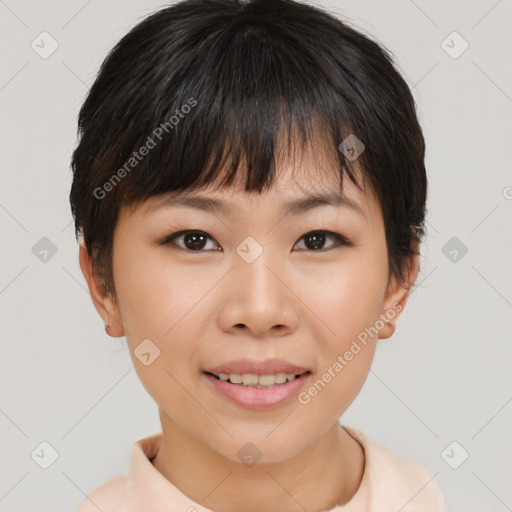 Joyful asian young-adult female with short  brown hair and brown eyes