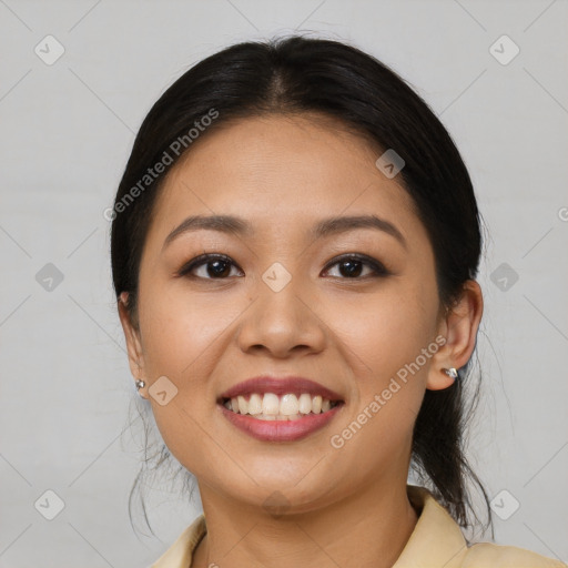 Joyful asian young-adult female with medium  brown hair and brown eyes