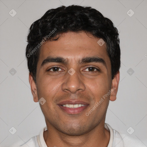 Joyful latino young-adult male with short  black hair and brown eyes