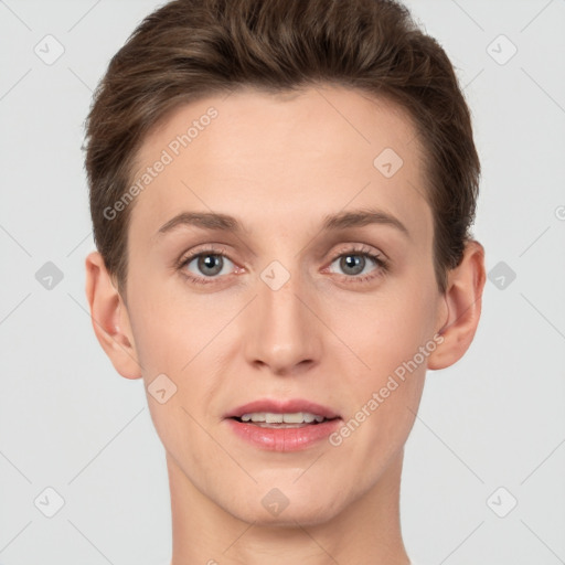 Joyful white young-adult female with short  brown hair and grey eyes