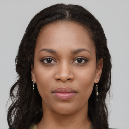 Neutral black young-adult female with long  brown hair and brown eyes