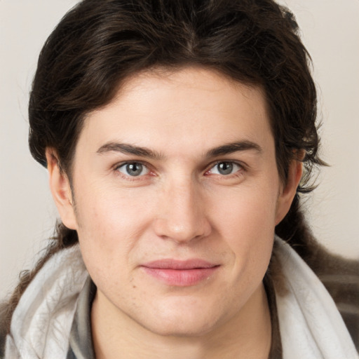 Joyful white young-adult male with medium  brown hair and brown eyes