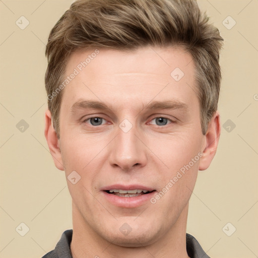 Joyful white adult male with short  brown hair and grey eyes