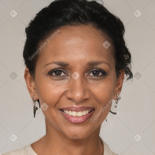 Joyful black adult female with short  brown hair and brown eyes