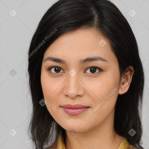 Joyful latino young-adult female with long  brown hair and brown eyes