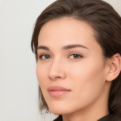 Neutral white young-adult female with long  brown hair and brown eyes