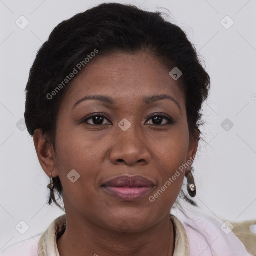 Joyful black adult female with short  brown hair and brown eyes