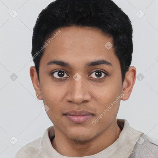 Joyful latino young-adult male with short  black hair and brown eyes