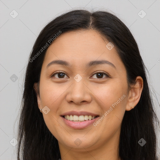 Joyful latino young-adult female with long  brown hair and brown eyes