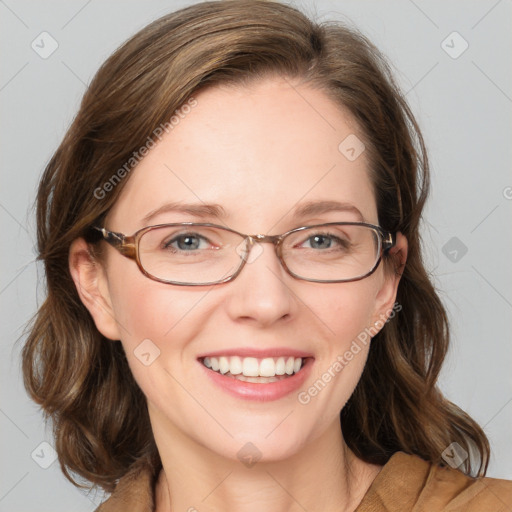 Joyful white adult female with medium  brown hair and blue eyes