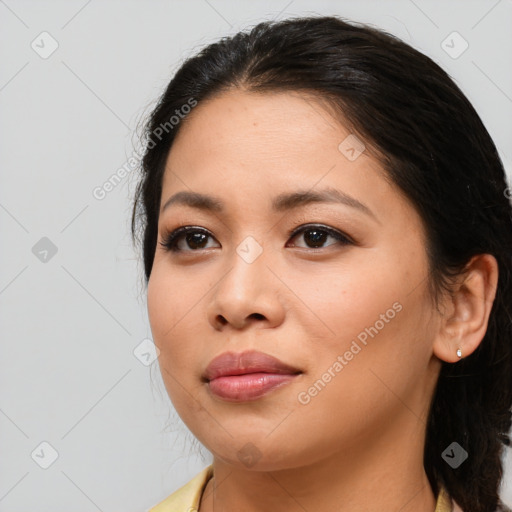 Joyful asian young-adult female with medium  brown hair and brown eyes