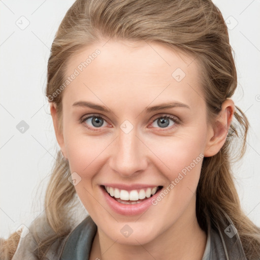 Joyful white young-adult female with long  brown hair and blue eyes