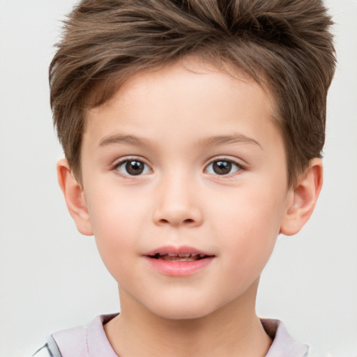 Joyful white child male with short  brown hair and brown eyes